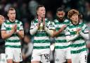 Celtic's players applaud their fans after Champions League defeat to Lazio at Parkhead tonight