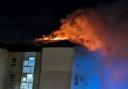 The fire burst through the roof of the block of flats