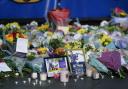 Lit candles among the flowers and messages left in tribute to Nottingham Panthers’ ice hockey player Adam Johnson outside the Motorpoint Arena in Nottingham, the home of the Panthers. Mr Johnson died after an accident during a Challenge Cup match with