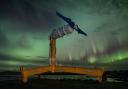 A turbine, framed by the northern lights, is prepared for deployment