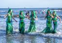 Mermaids take part in the Loony Dook 2024 in Kinghorn, Fife