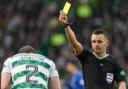 Referee Nick Walsh shows Celtic right back Alistair Johnston a yellow card during the cinch Premiership game against Rangers at Parkhead last week