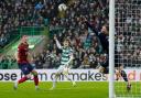 Celtic striker Kyogo Furuhashi watches as his header beats Kilmarnock keeper Will Dennis to open the scoring at Celtic Park.