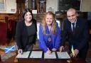 Leader of Glasgow City Council Susan Aitken and Lord Provost Jacqueline McLaren sign the Memorandum of Understanding between Glasgow and Mykolaiv witnessed by Ukrainian Consul General Andrii Kusli.