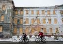 Viktoria* (L) and Oleh (R) cycle in winter conditions through Kharkiv, Ukraine on 18 November 2022