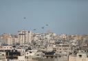 Humanitarian aid packages dropped from the air by Jordanian, US, Egyptian and French army planes are seen floating in the sky over Gaza City