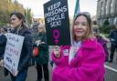 Members of campaign group, Women Won't Wheesht, protest outside Scottish Government building