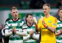Stephen Welsh, left, and Joe Hart applaud the Celtic supporters after their 3-1 win over St Johnstone at Parkhead on Saturday