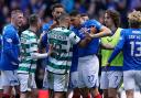 empers flare between Celtic’s Cameron Carter-Vickers and Rangers’ Leon Balogun during the cinch Premiership match at Ibrox Stadium,