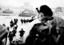 Piper Bill Millin in the foreground to the right, pipes Lord Lovat’s Commandos ashore on the Queen Red Beach sector of Sword Beach on D-Day