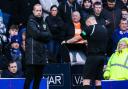 Referee John Beaton checks the pitchside monitor during the cinch Premiership game between Rangers and Celtic at Ibrox last Sunday as fourth official Willie Collum looks on