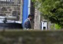 Humza Yousaf entering Bute House by a side door
