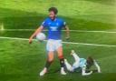The ball strikes Ben Davies' arm during Celtic vs Rangers