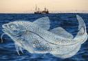 Sea birds and fishing vessels are seen in the North Sea off the east coast of Scotland on December