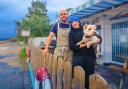 Kirsty and Gordon Decaestecker, with westie Mac, outside Mara Fish Bar & Deli, Corrie.