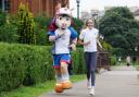 Eilish McColgan with Commonwealth Games mascot Finnie: But is the passion there?
