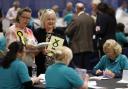 Members of the SNP observe as ballot papers are counted in Perth