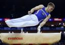 Gymnasts are scored by two different systems at the Olympics