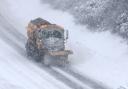 A snow plough in heavy snow. Photograph: Andrew Milligan/PA Wire.