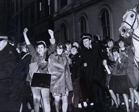 The Herald: Police hold back some of the fans who gathered outside the Renfield Street Odeon, hoping to see the Beatles on April 30, 1964 The Herald: Police hold back some of the fans who gathered outside the Renfield Street Odeon, hoping to see the Beatles on April 30, 1964