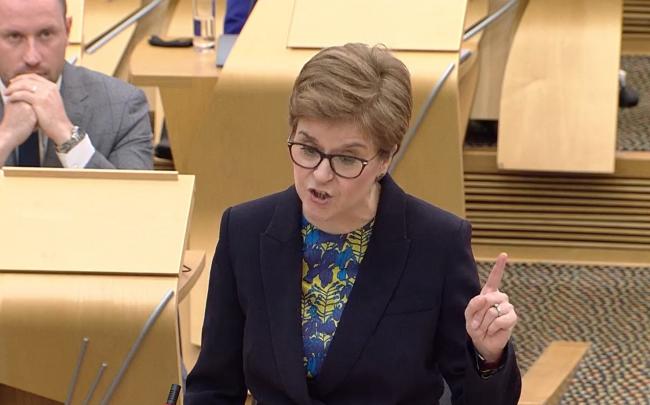 Sturgeon criticises Ross for looking at phone as Universal Credit cut raised