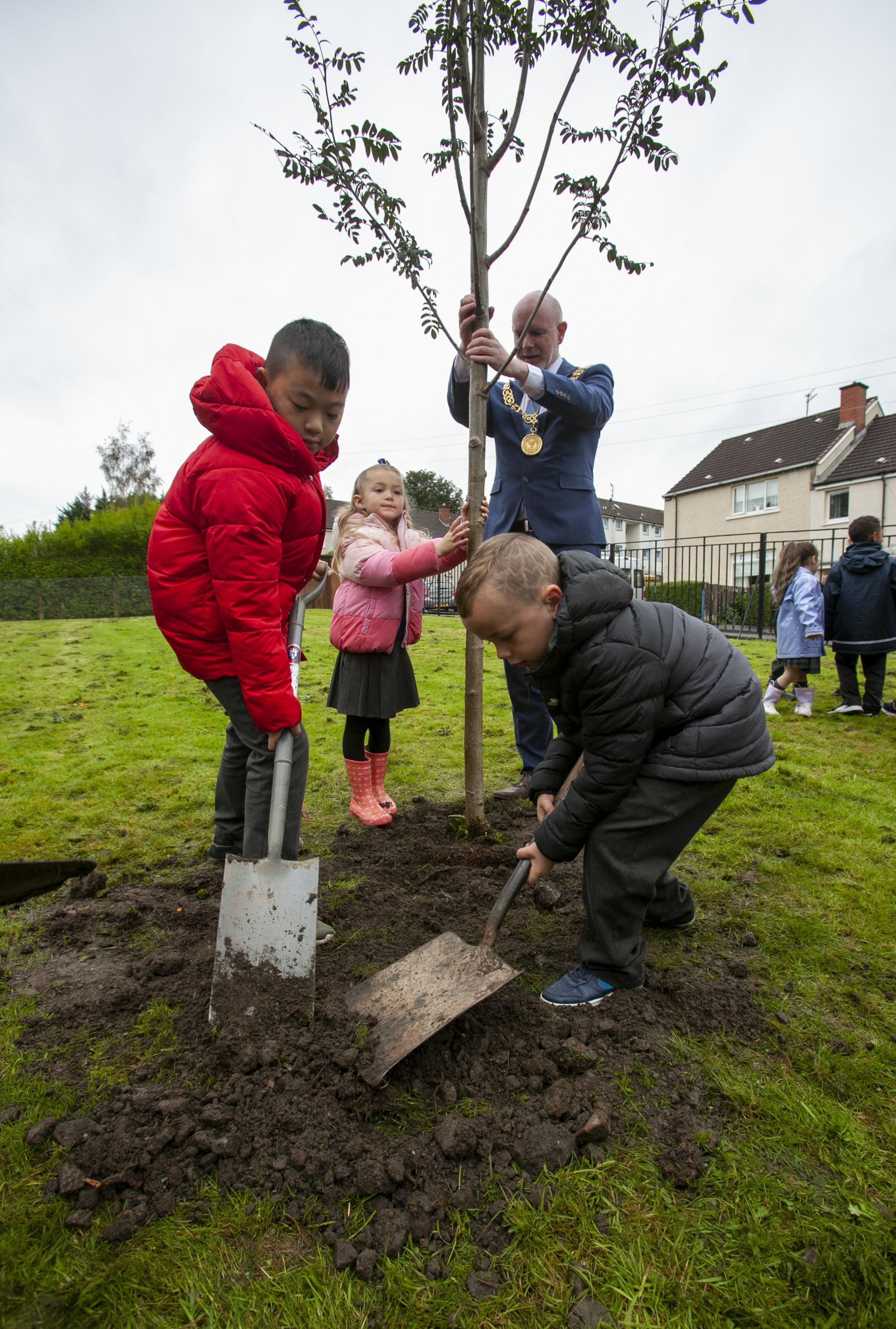 Glasgow Lord Provost Philip Braat in his as Lord Lieutenant, representing the Queen, pictured planting a tree at Cadder Primary school. He is pictured with members of the schools eco committee, from left Jason Lam, Orlagh Gallagher, Junior Mactavish