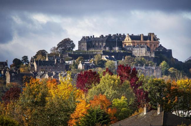 Stirling Castle surrounded by trees displaying their Autumn colours. PA Photo. Picture date: Sunday October 11, 2020. Photo credit should read: Jane Barlow/PA Wire...