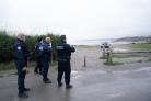 French police look out over a beach near Wimereux in France believed to be used by migrants trying to get to the UK after a boat capsized off the French coast with the loss of 27 lives