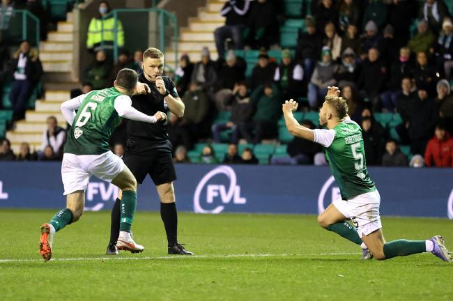 Hibernian's Ryan Porteous can't believe it as referee John Beaton correctly awards a penalty for his challenge on Rangers winger Ryan Kent.