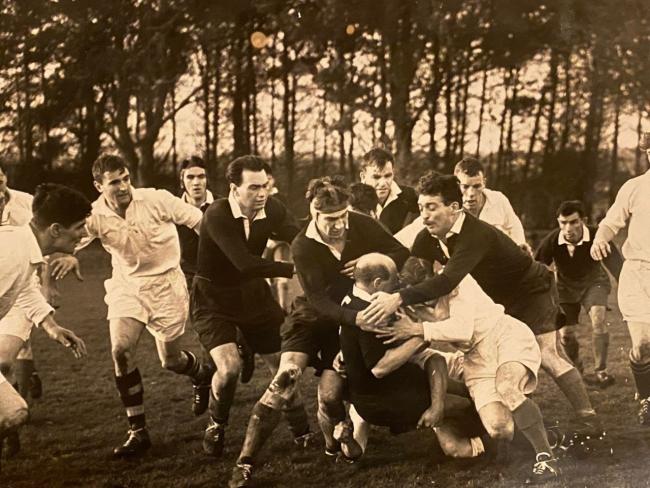 Ernie Michie, seen here in the scrum cap, played for his country 15 times between 1954 and 1957