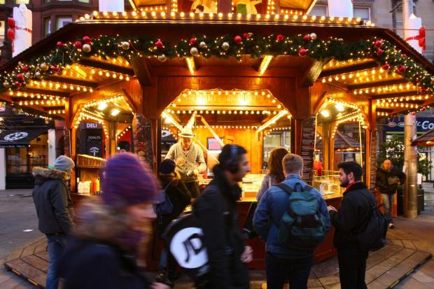 St Enoch square Christmas market. The German food stall...   Photograph by Colin Mearns