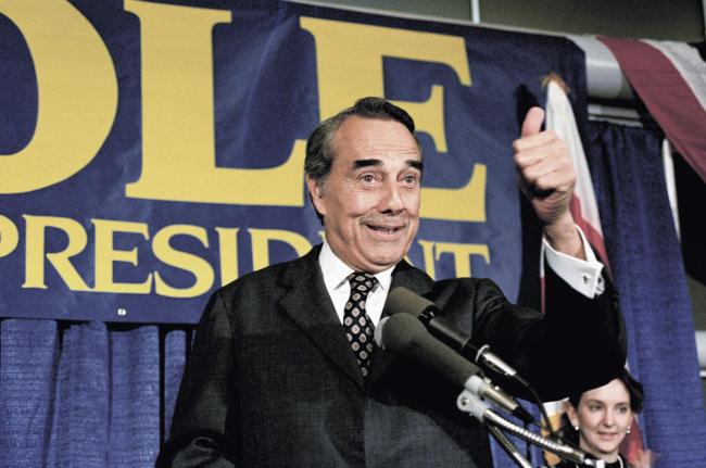 Bob Dole, pictured in 1988, overcame serious war wounds to become leader of the Senate         (Picture: AP/Ron Edmonds)