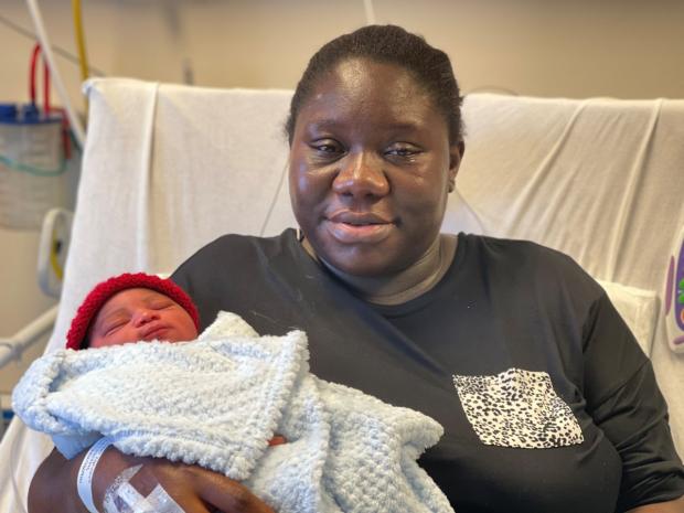 HeraldScotland: Elohu Egwowa with her baby