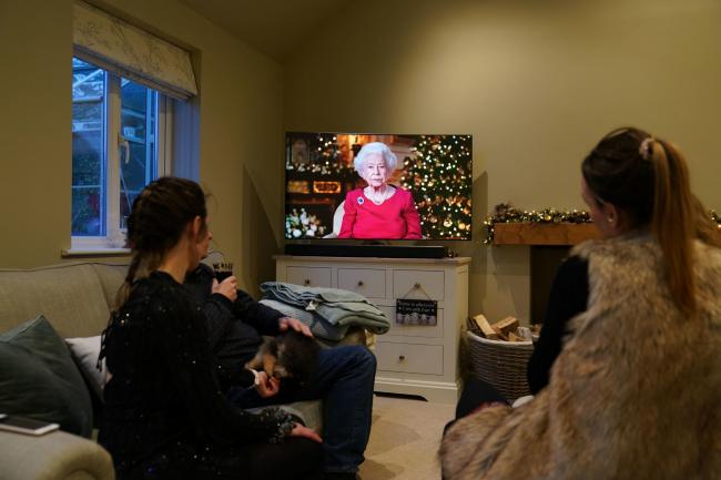 A family watching the Queen's Christmas broadcast of 2021. Over the years, viewing figures have dwindled