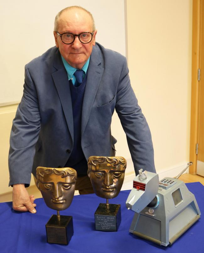 Bob Baker, photographed with his Bafta awards for Wallace and Gromit, and with the Doctor Who canine character, K9