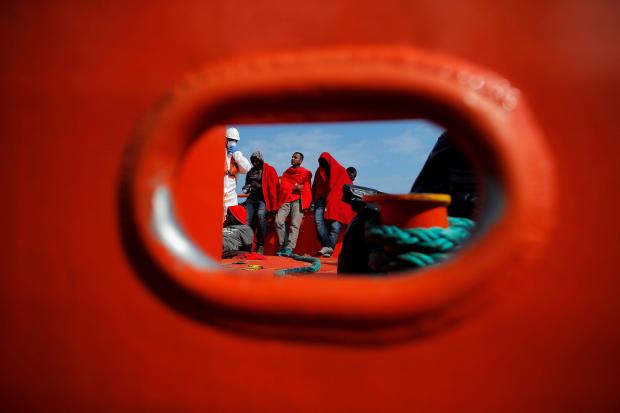 HeraldScotland:  Migrants who were intercepted aboard a pair of dinghies in the Mediterranean arrived at the Port of Málaga, Spain, in 2018. (Jon Nazca/Reuters)
