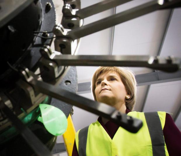 HeraldScotland: First Minister Nicola Sturgeon visits an oil services firm in Aberdeen in February 2015. During her visit she said the UK Government could not ignore calls for urgent tax changes that could spark a “resurgence” in the North Sea. Picture: Danny Lawson/PA Wire