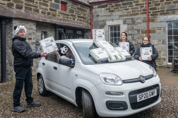 Mains of Taymouth Country Estate & Golf Course staff roll out the Cheeky Panda toilet roll that is available in all its holiday properties now and has a deep connection to the surrounding area