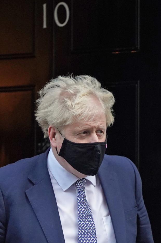 HeraldScotland: Prime Minister Boris Johnson leaves 10 Downing Street, London, to attend Prime Minister's Questions at the Houses of Parliament. Picture date: Wednesday January 12, 2022. PA Photo. See PA story POLITICS PMQs. Photo credit should read: Stefan