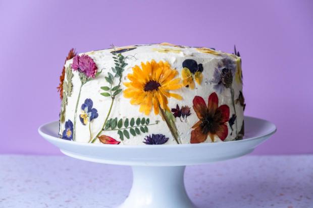 A cake decorated with edible flowers