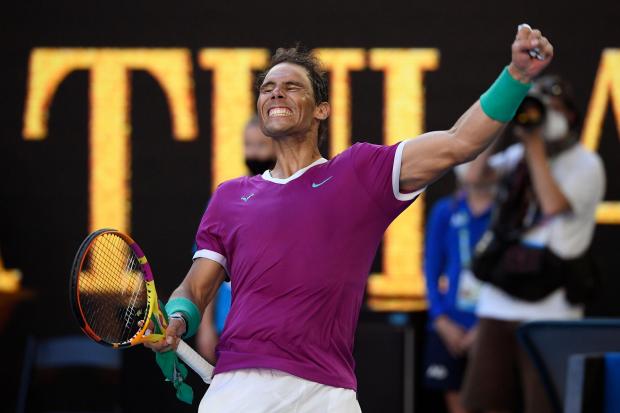 Rafael Nadal punches the air after beating Denis Shapovalov