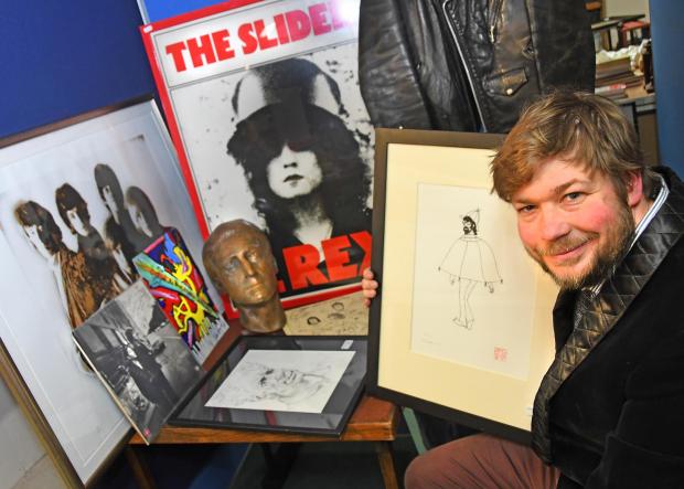 HeraldScotland: Antiques expert and auctioneer Angus Ashworth with pop and rock memorabilia. Picture: David Harrison