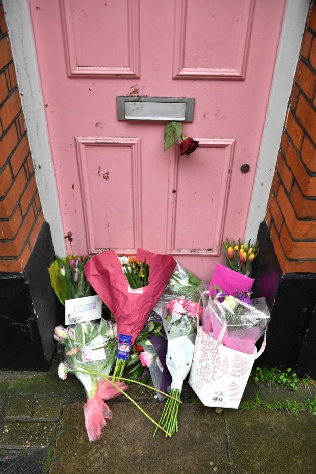 HeraldScotland: Floral tributes left outside Caroline Flack’s former home in north London in 2020 (Dominic Lipinski/PA)