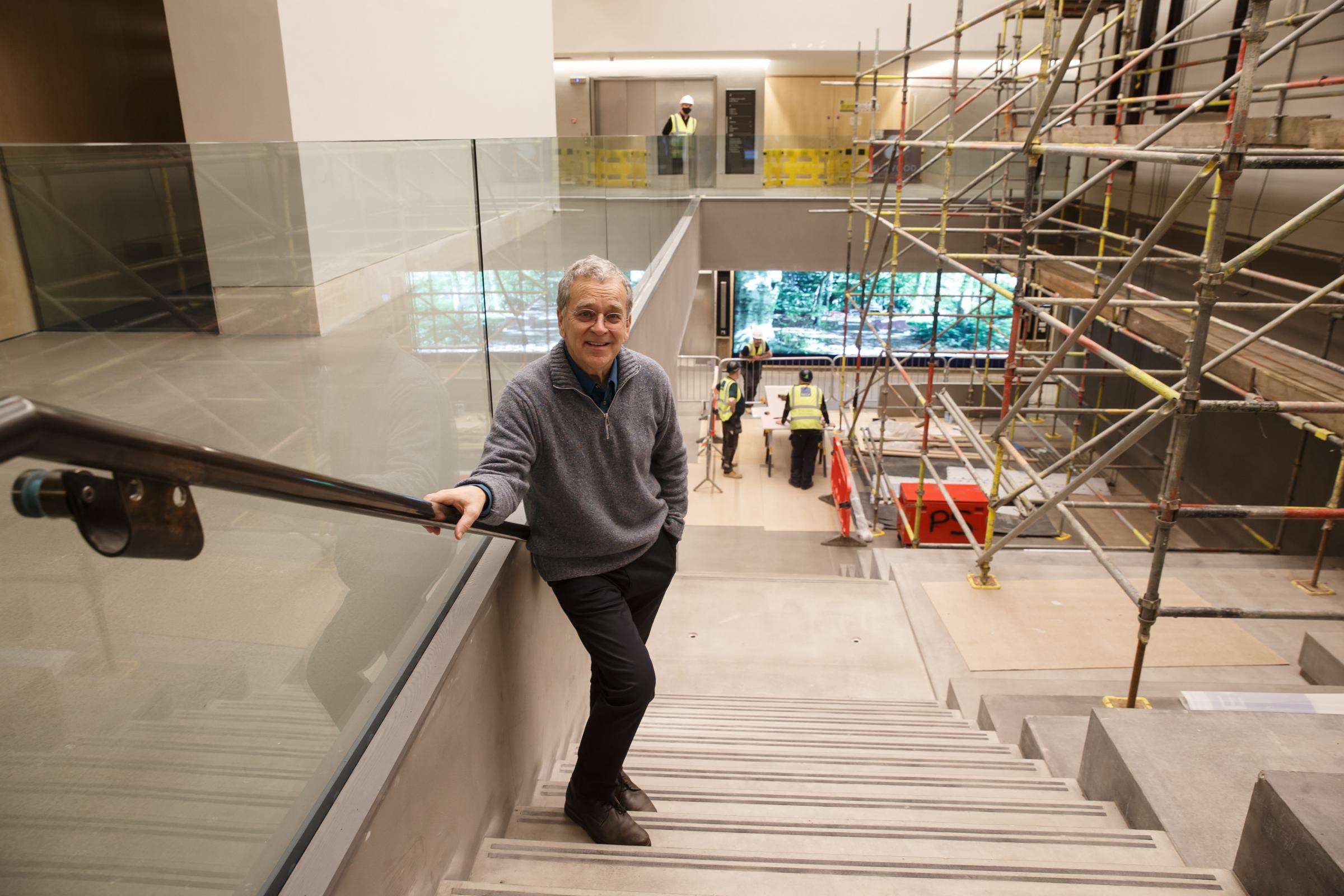 Architect John McAslan of John McAslan + Partners. He is pictured in the new central staircase. Photograph by Colin Mearns.