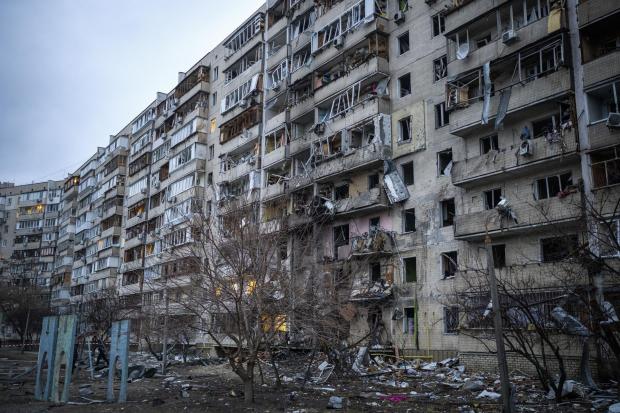 HeraldScotland: View of a building damaged following a rocket attack the city of Kyiv, Ukraine, Friday, Feb. 25, 2022. (AP Photo/Emilio Morenatti)