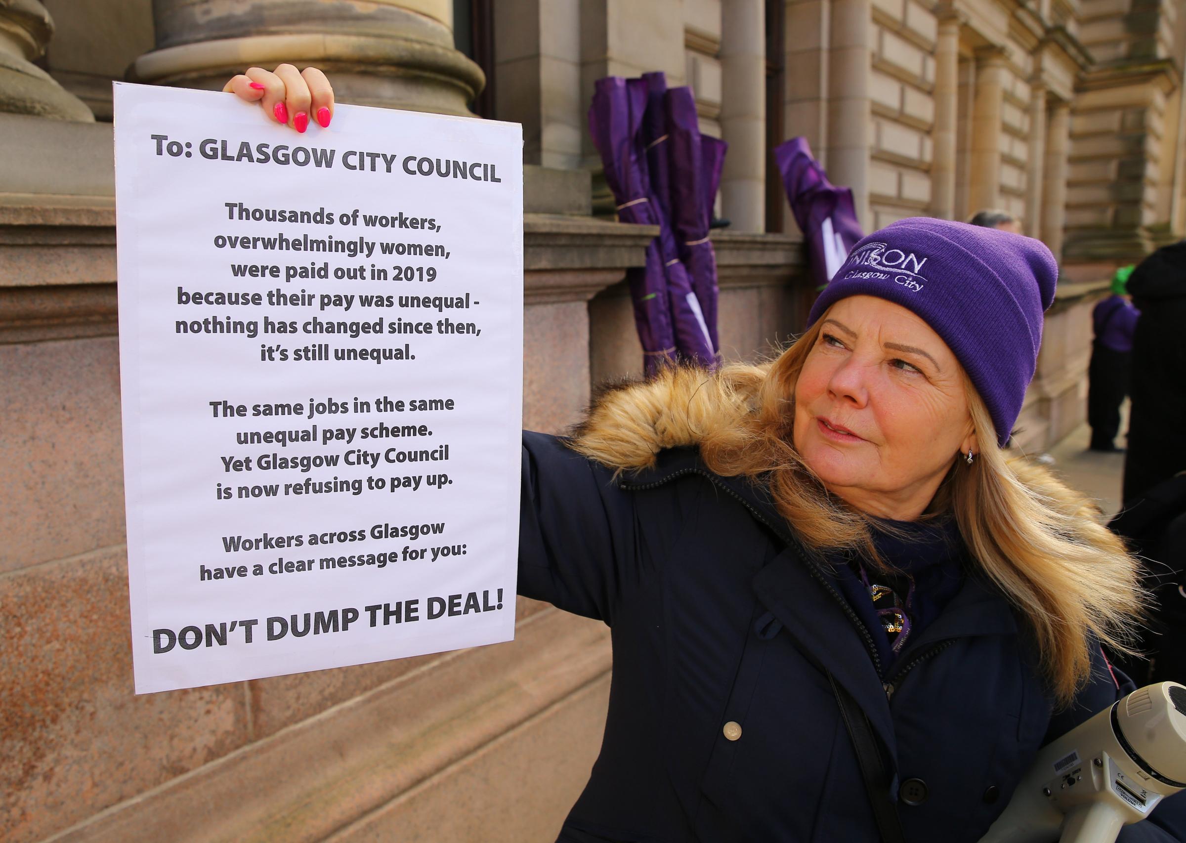 Equal pay compensation dispute protest at Glasgow City Chambers in January. Pictured is Kath Stirling, Glasgow City Unison branch chair with a letter to Annemarie ODonnell , chief executive of Glasgow City Council.