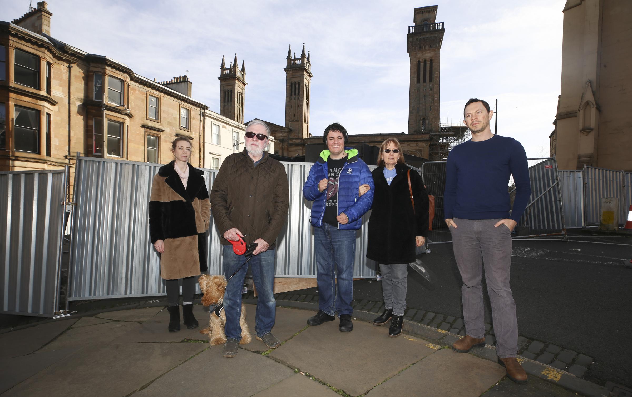 A ring of steel remains around Trinity Tower in Glasgows Park Circus which has displaced residents. From left, Francesca Barrow, Dr john Doyle, Rosemary McIlroy and son Jamie, Doron Finkelstein. Photo by Gordon Terris.