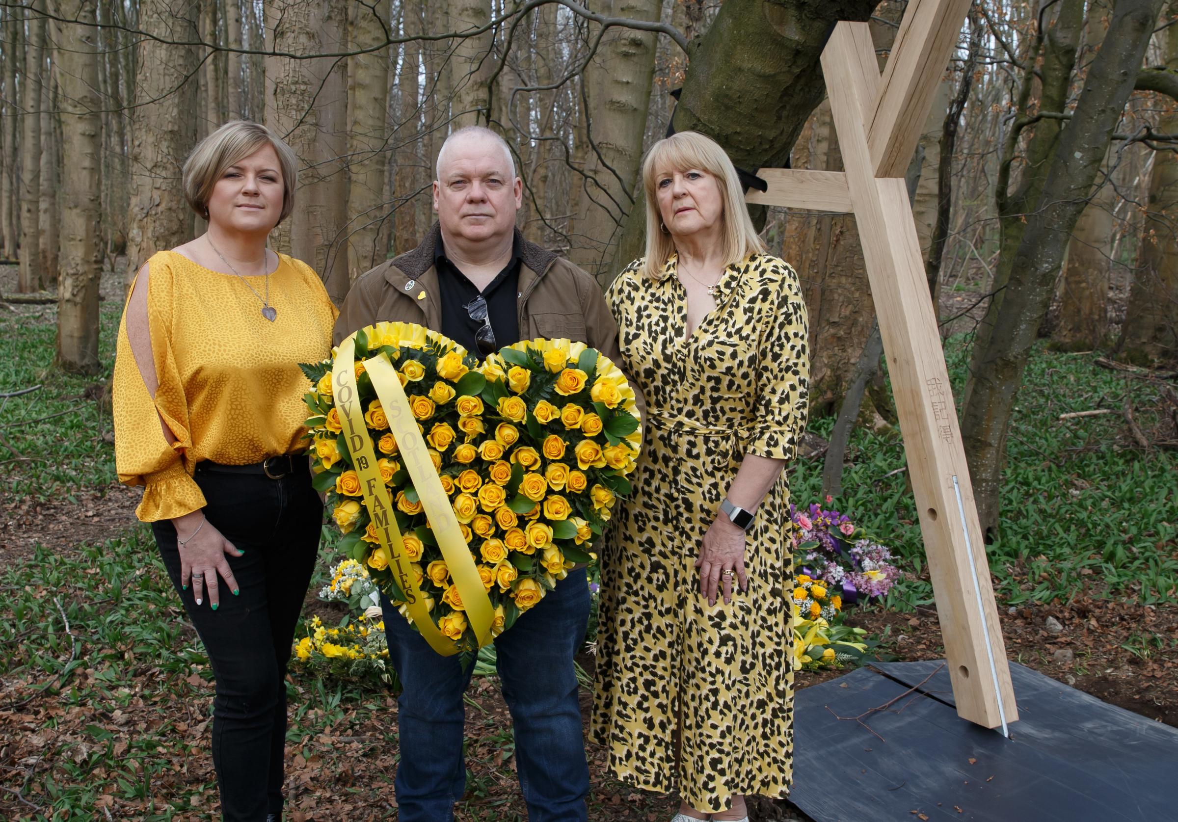 Pictured next to the first of a series of tree supports at Pollok Country park, Glasgow today are, from Covid 19 Families Scotland, from left - Connie McCready, Peter McMahon and Carolyn Murdoch. Photograph by Colin Mearns.