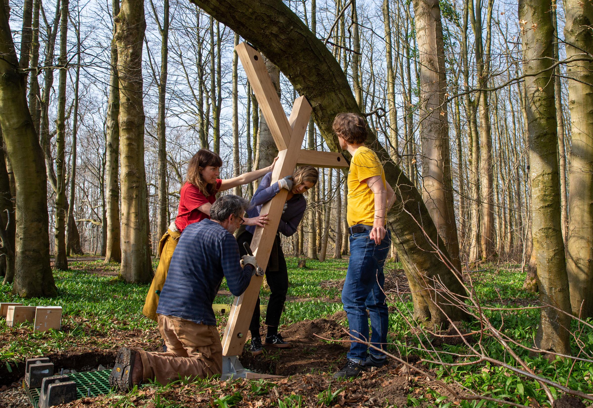 Artist Alec Finlay, at right, installing the first of the Covid memorial tree supports in Pollok Country Park. Pictured with Alec, are from left, Rachel Smith, Alastair Leitch and Kate McAllan. Photograph by Colin Mearns.