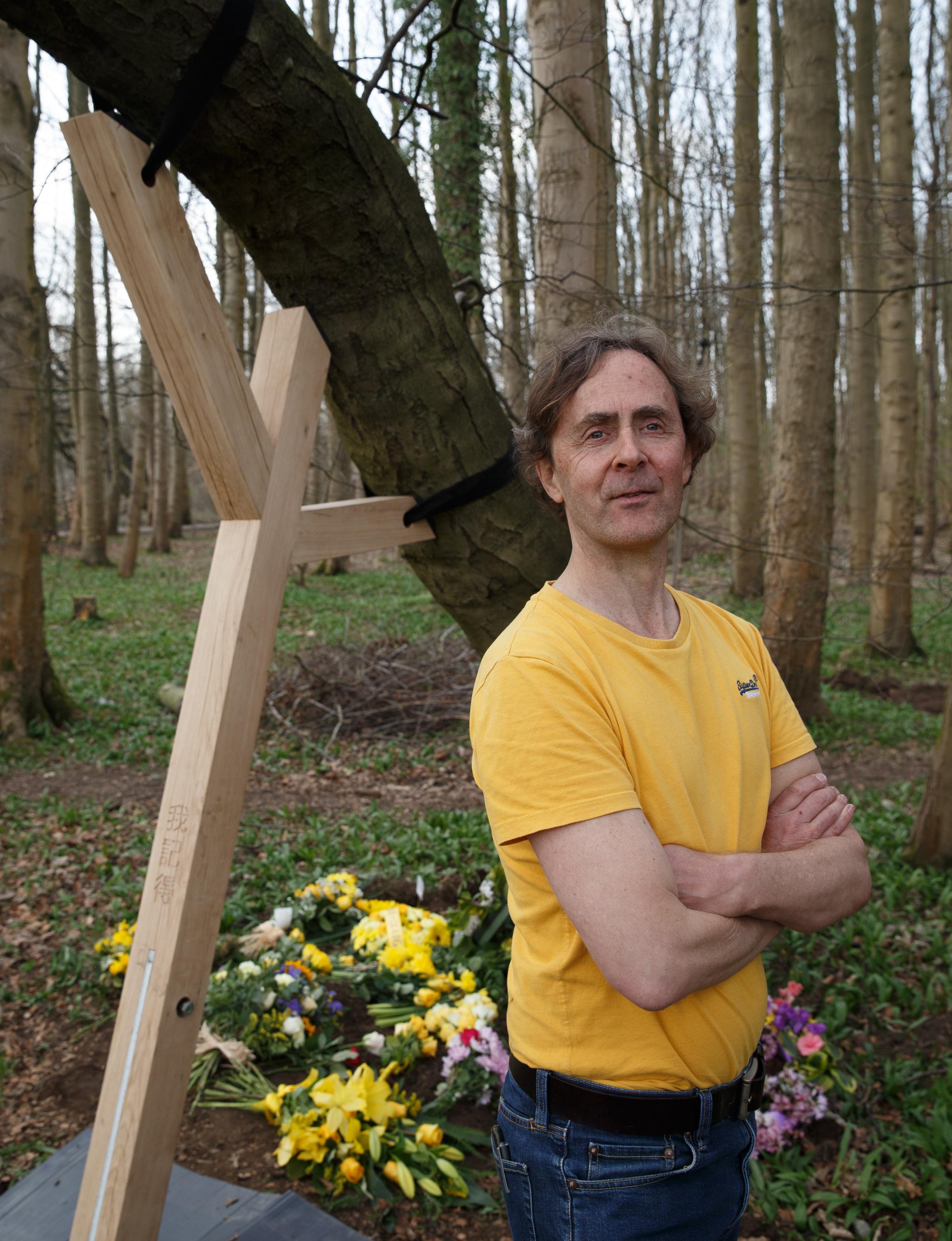 Artist Alec Finlay installing the first of the Covid memorial tree supports in Pollok Country Park. Photograph by Colin Mearns.